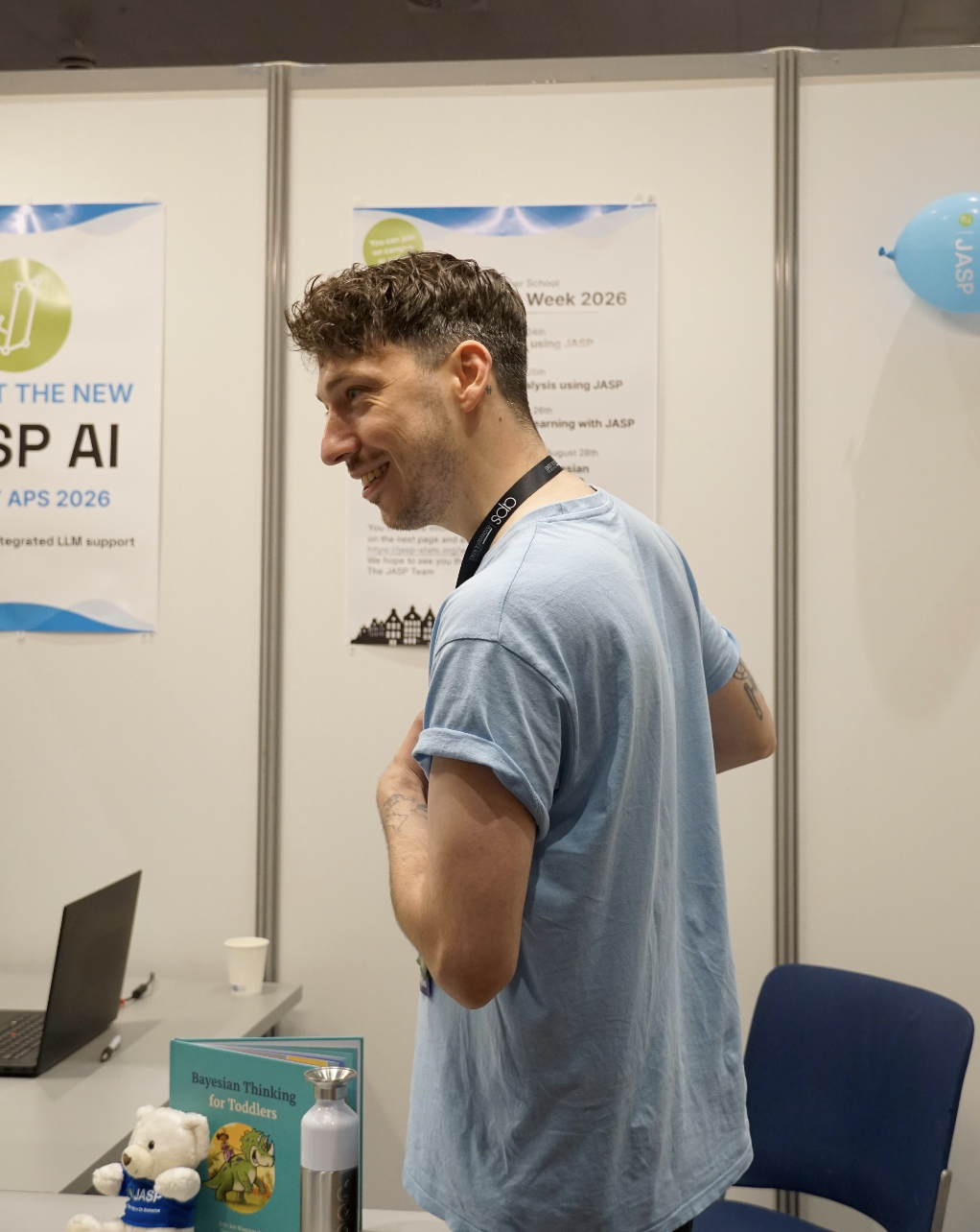 Henrik R. Godmann at a JASP conference booth